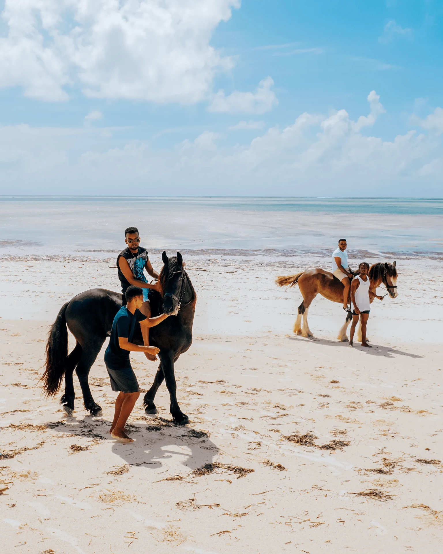 Group ride on the beach, horse riding photography in Zanzibar