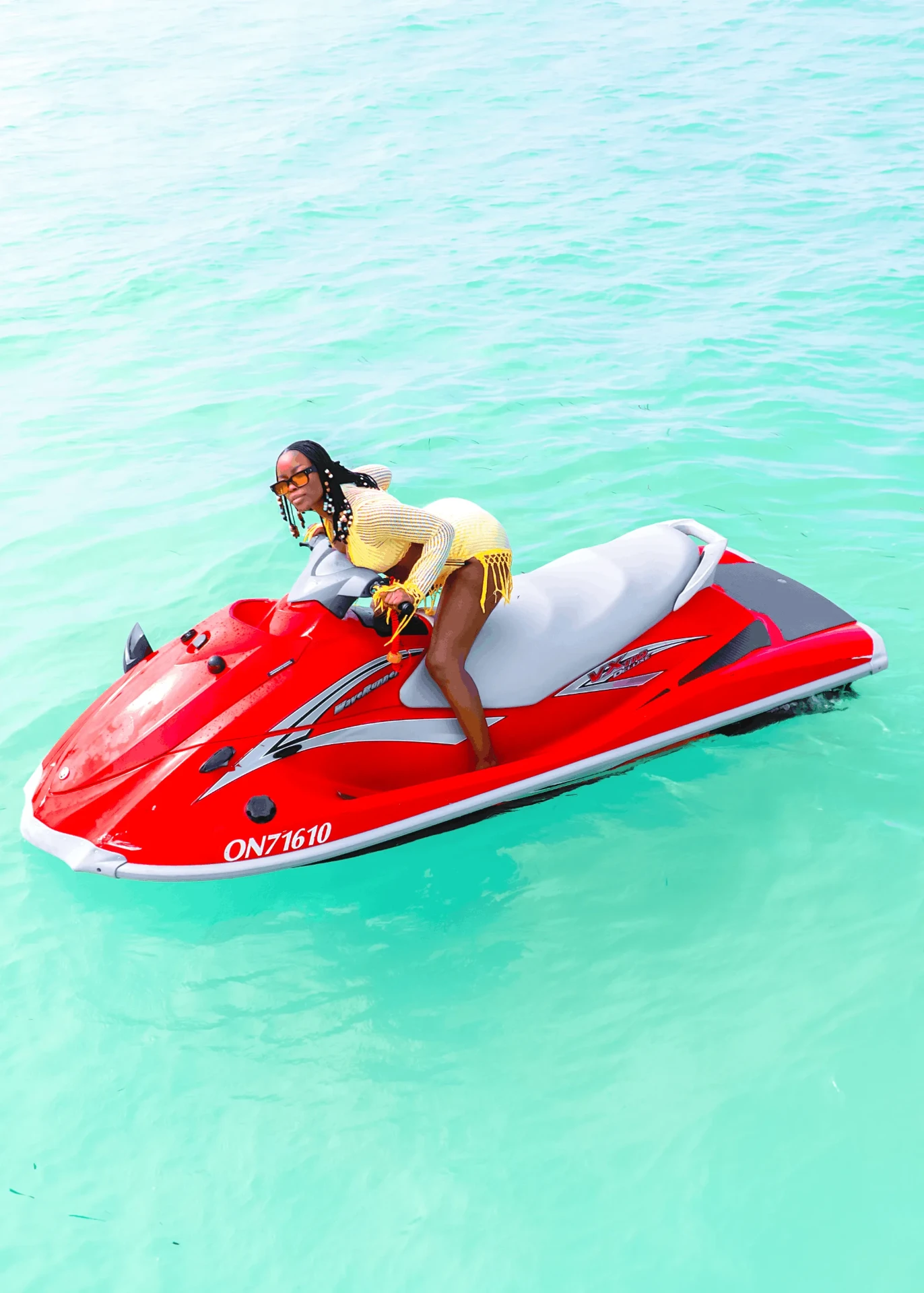 Drone shot leaning across a red jet ski, jet ski photography in Zanzibar