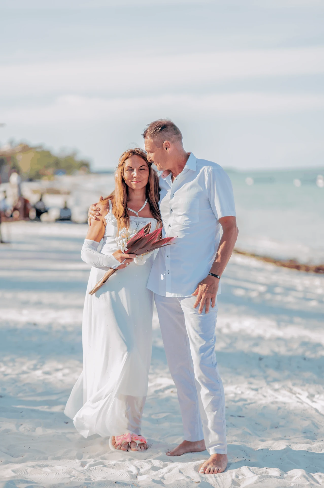Bride and groom on the beach after the ceremony, wedding photography in Zanzibar