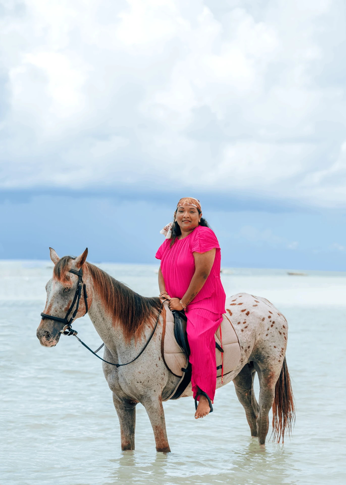 Portrait in the ocean shallows, horse riding photography in Zanzibar